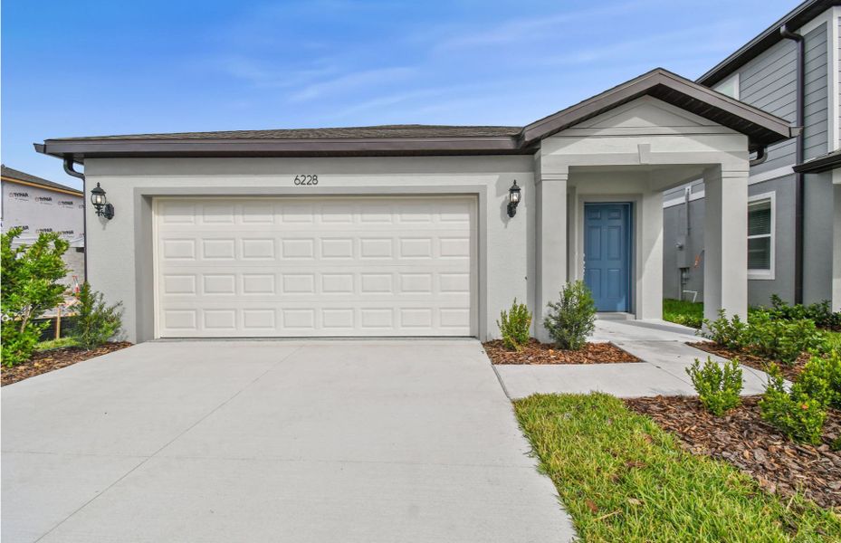 Representative exterior photo of a completed home built from the Harvey by Pulte Homes in Riverwood, Zephyrhills, FL (Image 14).