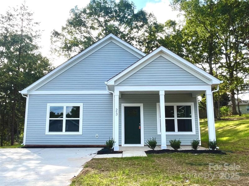 Front exterior of a new home in , Granite Falls, NC, highlighting curb appeal (Image 18).