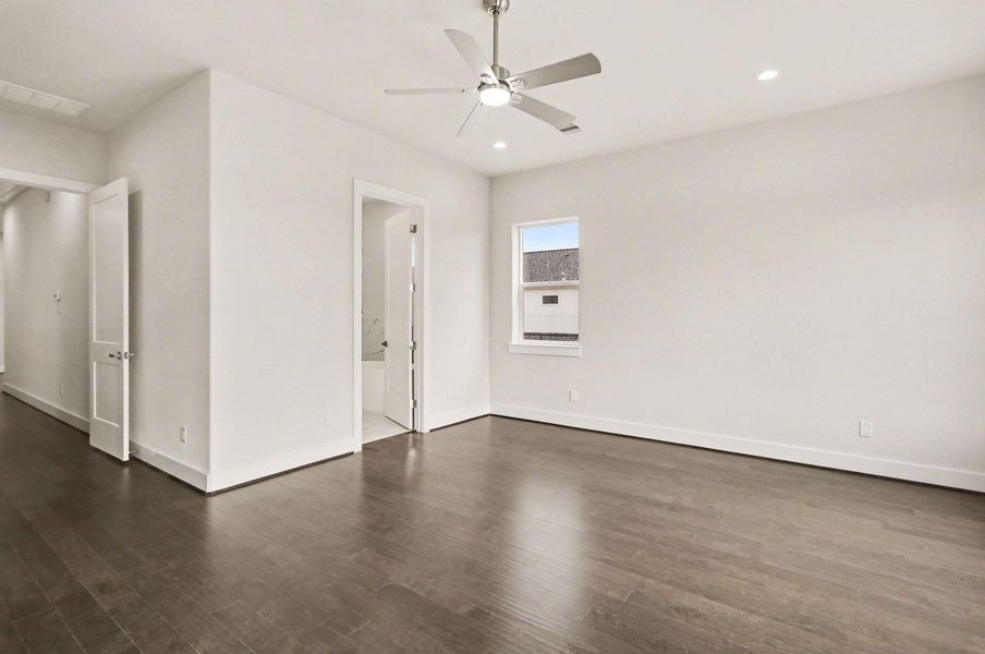 Expansive owner’s suite offering flexibility for a sitting area or workspace.