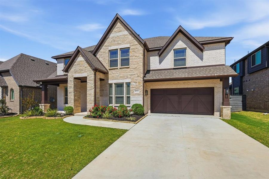 Front exterior of a new home in Union Park, Little Elm, TX, highlighting curb appeal (Image 26). Front exterior of a new home in Union Park, Little Elm, TX, highlighting curb appeal (Image 26).