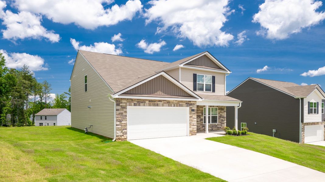 Front exterior of a new home in Byrd Farms, Dayton, TN, highlighting curb appeal (Image 19). Front exterior of a new home in Byrd Farms, Dayton, TN, highlighting curb appeal (Image 19).