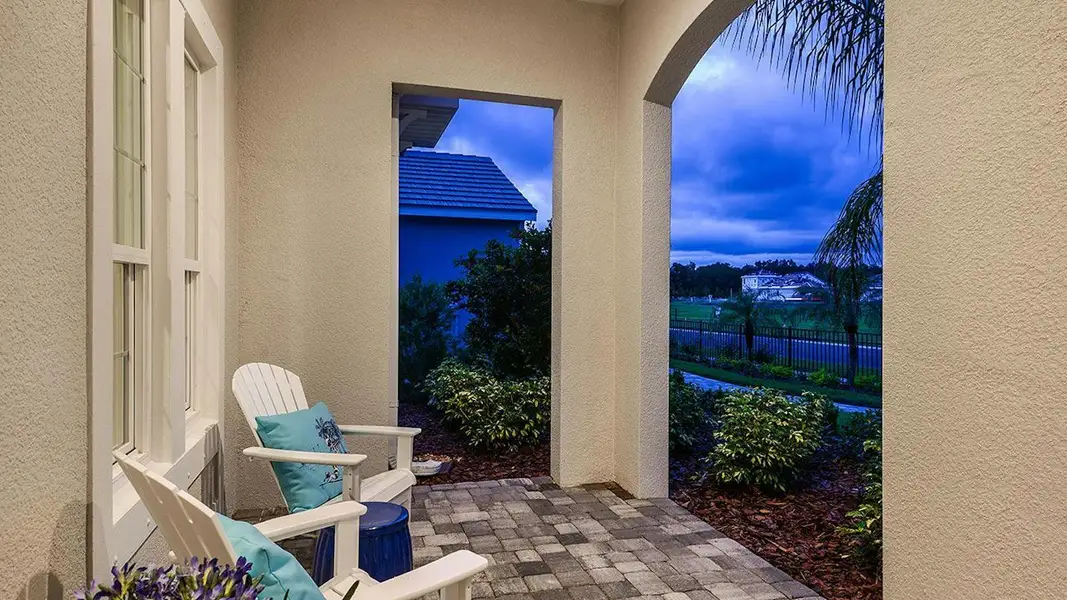 Exterior details and patio area of a home in Boca Royale Golf & Country Club Real Estate and Homes for Sale in Englewood, FL - Neal Communities, Englewood (Image 4).