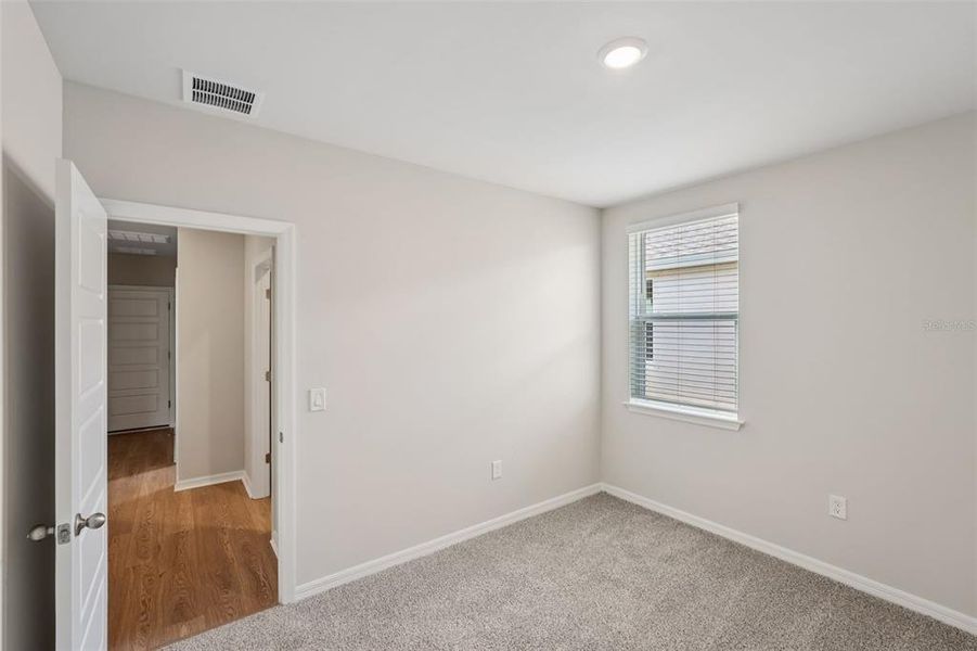 Spacious, unfurnished interior of a new home in Crescent Lakes - Premier Series, Punta Gorda (Image 25).