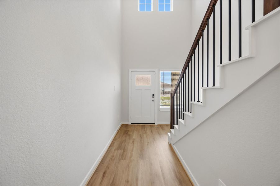 Elegant stairs welcome you inside with high ceilings! Elegant stairs welcome you inside with high ceilings!