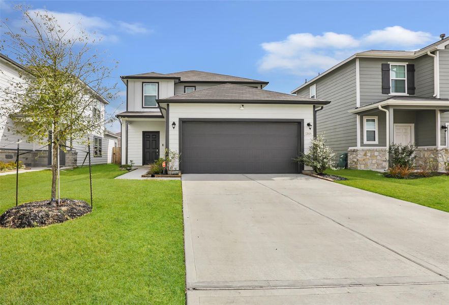 Front exterior of a new home in Barrett Crossing, Crosby, TX, highlighting curb appeal (Image 1). Front exterior of a new home in Barrett Crossing, Crosby, TX, highlighting curb appeal (Image 1).
