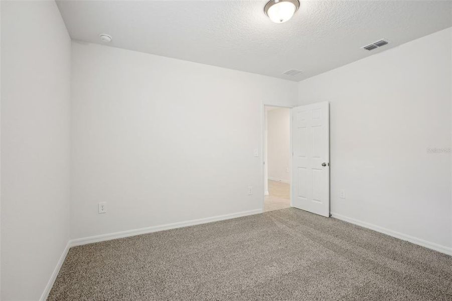 Spacious, unfurnished interior of a new home in Villamar - Signature Series, Winter Haven (Image 24).