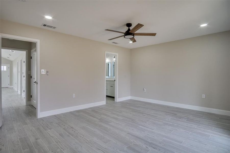 Unfurnished room featuring baseboards, visible vents, light wood finished floors, recessed lighting, and ceiling fan