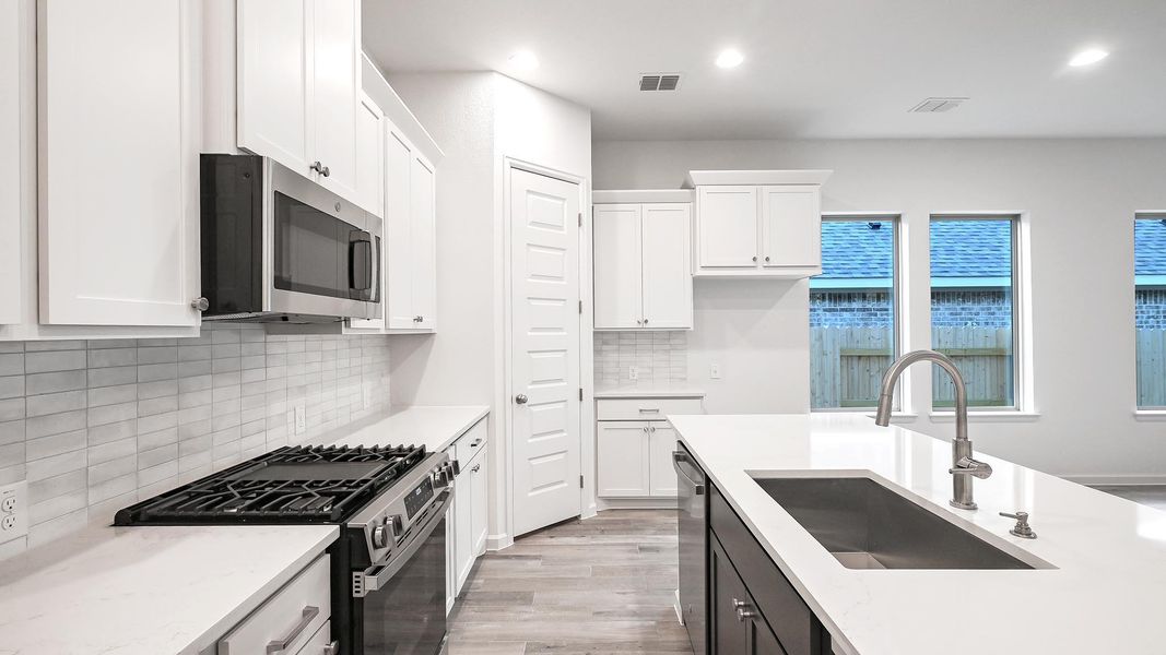 Furnished interior view inside a new home in Crosswinds, Kyle (Image 11).