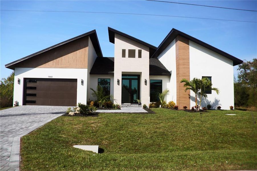 Front exterior of a new home in , Port Charlotte, FL, highlighting curb appeal (Image 30). Front exterior of a new home in , Port Charlotte, FL, highlighting curb appeal (Image 30).