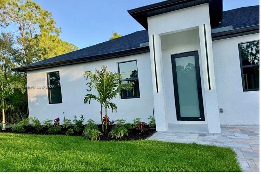 Exterior details and patio area of a home in , Lehigh Acres (Image 18). Exterior details and patio area of a home in , Lehigh Acres (Image 18).