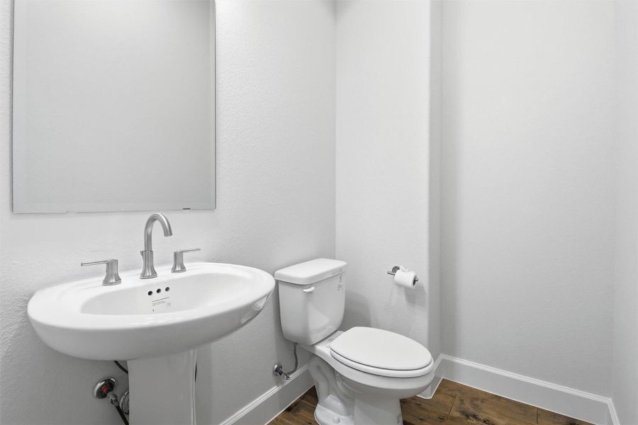 Powder bath with pedestal sink.