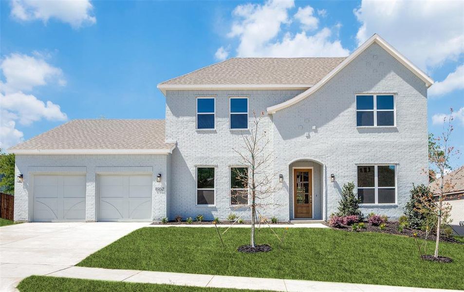 View of front facade with a garage and a front yard