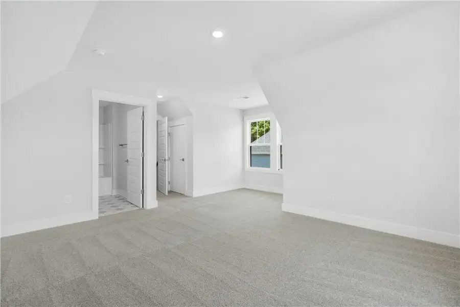 A spacious, naturally illuminated room featuring p A spacious, naturally illuminated room featuring p