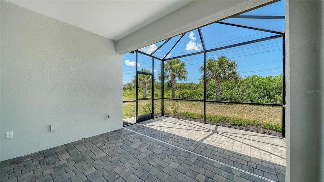 Exterior details and patio area of a home in Windward Real Estate and Homes for Sale in Sarasota, FL - Neal Communities, Lakewood Ranch (Image 4).