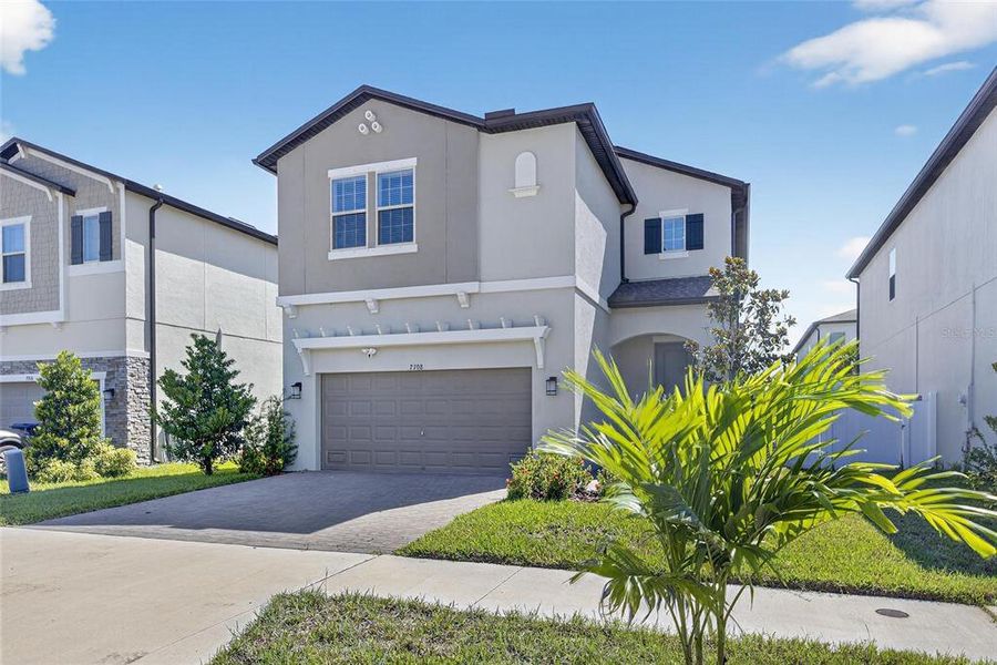 Front exterior of a new home in , Tampa, FL, highlighting curb appeal (Image 22).