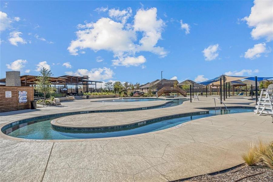 Community pool with a patio
