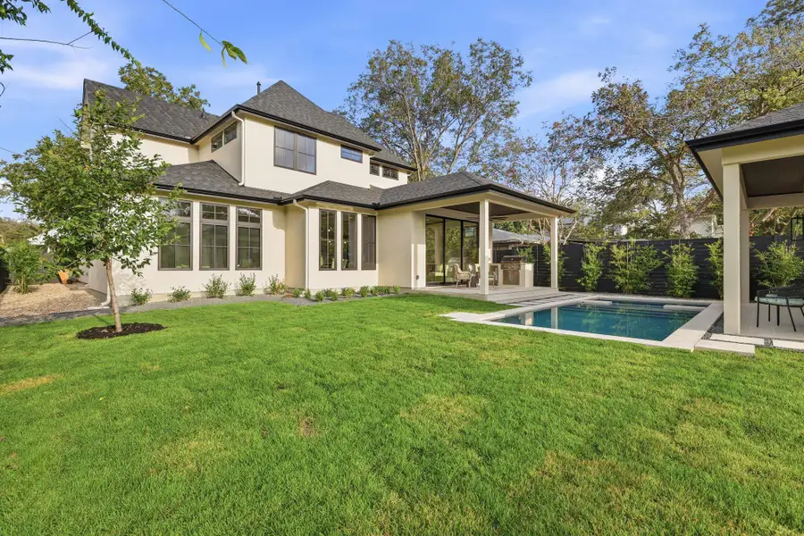 View of large backyard with plenty or room for kids to play