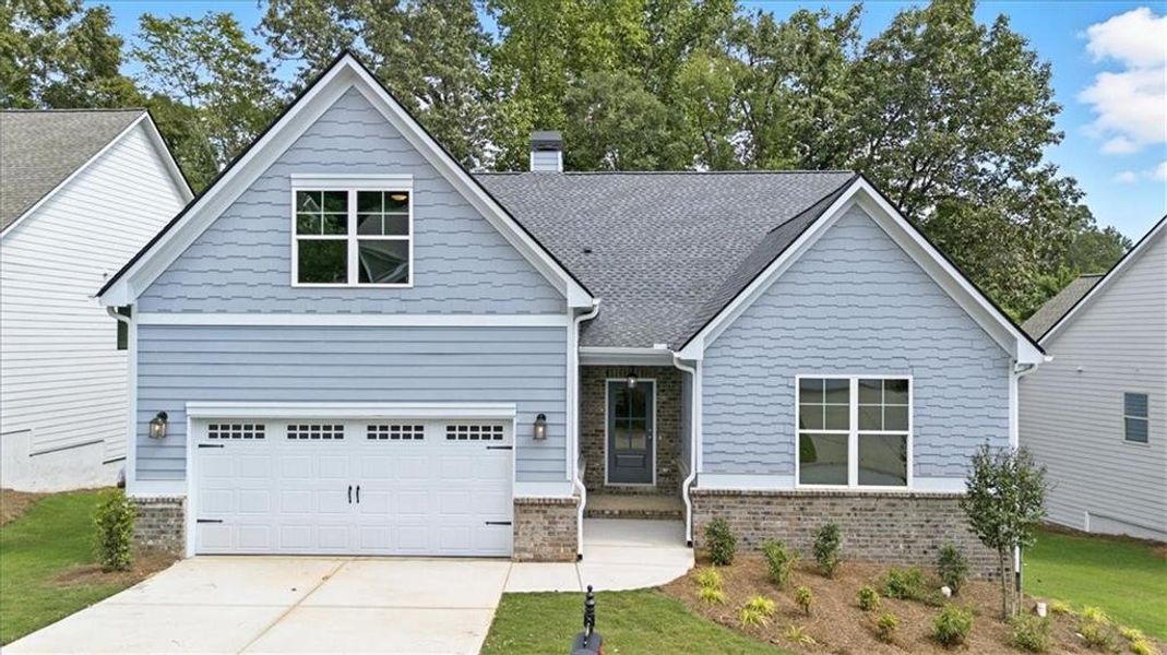 Front exterior of a new home in Traditions of Braselton, Jefferson, GA, highlighting curb appeal (Image 25). Front exterior of a new home in Traditions of Braselton, Jefferson, GA, highlighting curb appeal (Image 25).