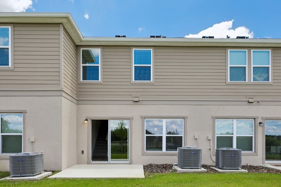 Exterior details and patio area of a home in Reserve at Forest Lake Townhomes, Lake Wales (Image 2). Exterior details and patio area of a home in Reserve at Forest Lake Townhomes, Lake Wales (Image 2).