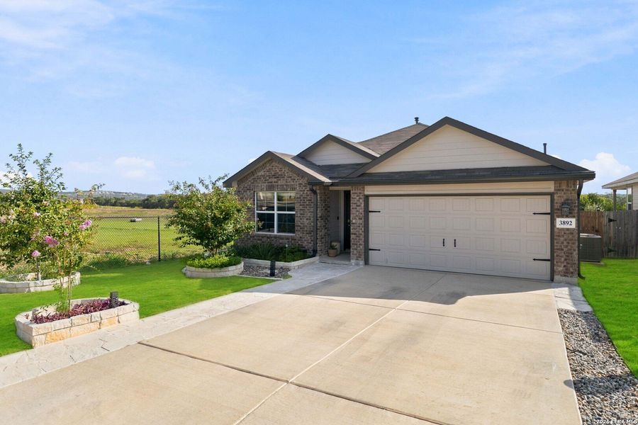 Front exterior of a new home in Copper Canyon, Bulverde, TX, highlighting curb appeal (Image 22).