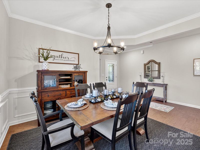 Beautiful Great Room with Wood Floors, Fan and Accent Wall Custom Bishop's Paneling