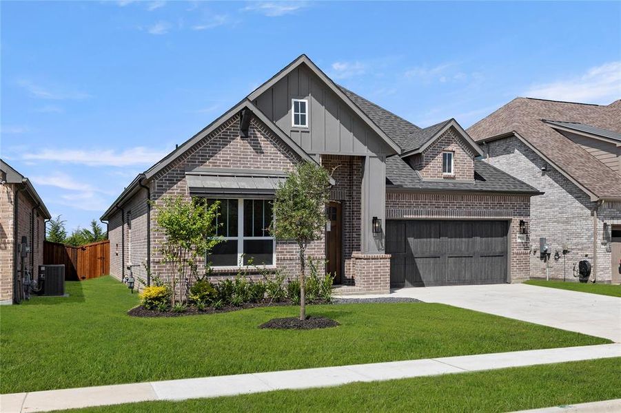 Front exterior of a new home in The Highlands, Rockwall, TX, highlighting curb appeal (Image 2).