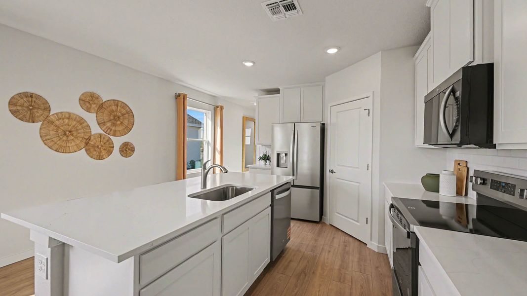 Representative furnished interior of a home built from the Harper by D.R. Horton in Venetian Grove, Vero Beach (Image 7).