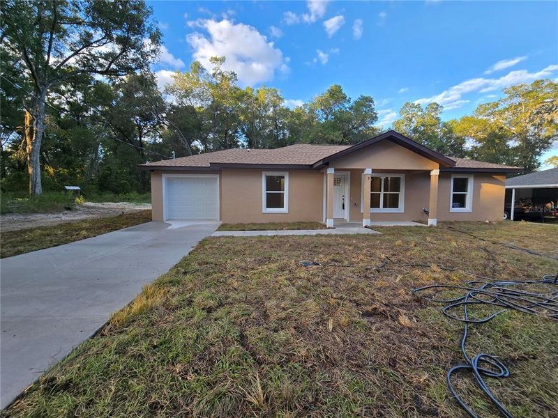 Front exterior of a new home in , Ocala, FL, highlighting curb appeal (Image 1).