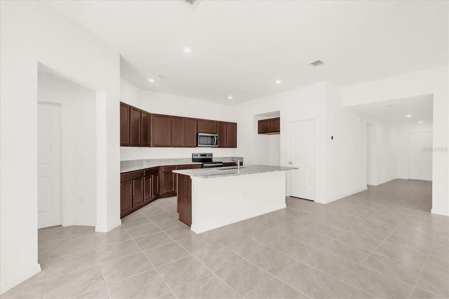 Furnished interior view inside a new home in Landings at Lake Mabel Loop, Dundee (Image 6).