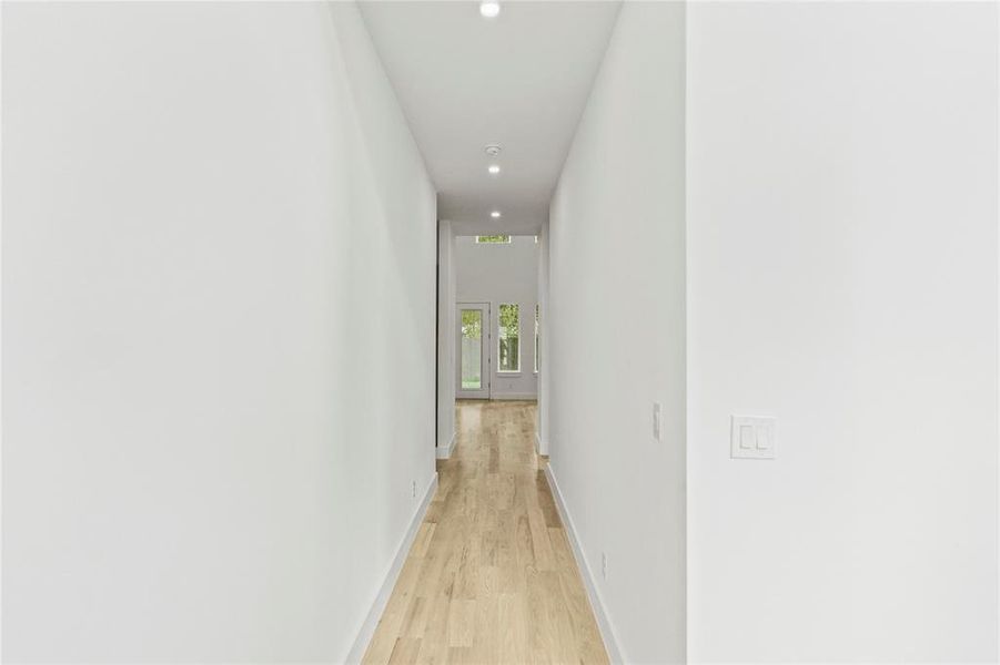 Hallway with light wood-type flooring