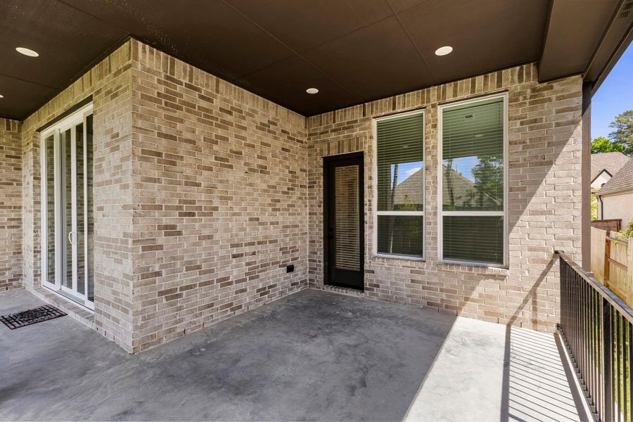 Exterior details and patio area of a home in Woodforest, Montgomery (Image 31).