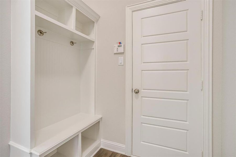 Mudroom with dark hardwood / wood-style floors