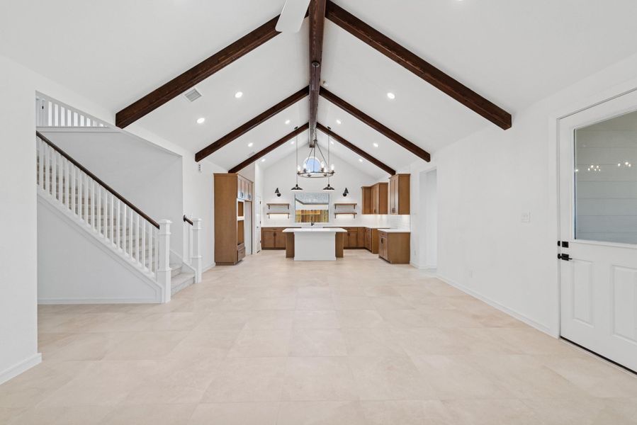 Stunning living space with vaulted ceilings and stained beams