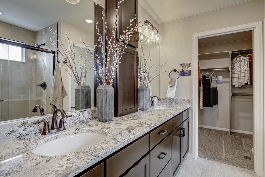 tep into luxury and relaxation with the primary bathroom, a haven of comfort and sophistication designed to elevate your daily routine. Featuring a double vanity, this space offers ample room for you to indulge in your own personalized grooming