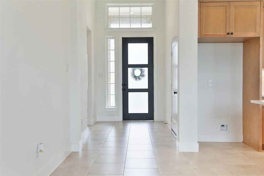 You’re greeted with ceramic tile flooring throughout the main living area, where an abundance of natural light fills the space, creating a warm and inviting atmosphere. You’re greeted with ceramic tile flooring throughout the main living area, where an abundance of natural light fills the space, creating a warm and inviting atmosphere.