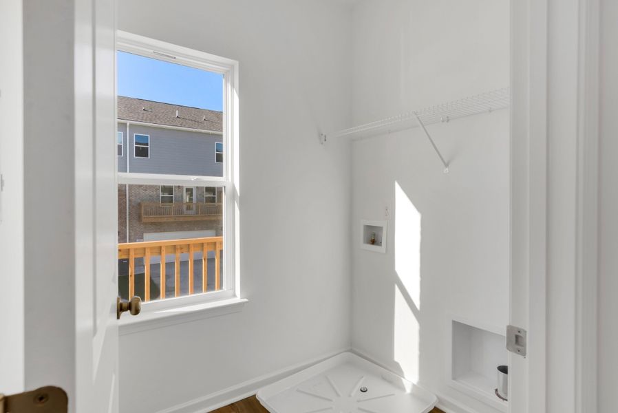 Bright walk in laundry room