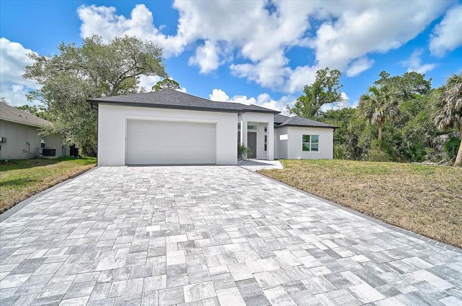 Front exterior of a new home in , North Port, FL, highlighting curb appeal (Image 28).