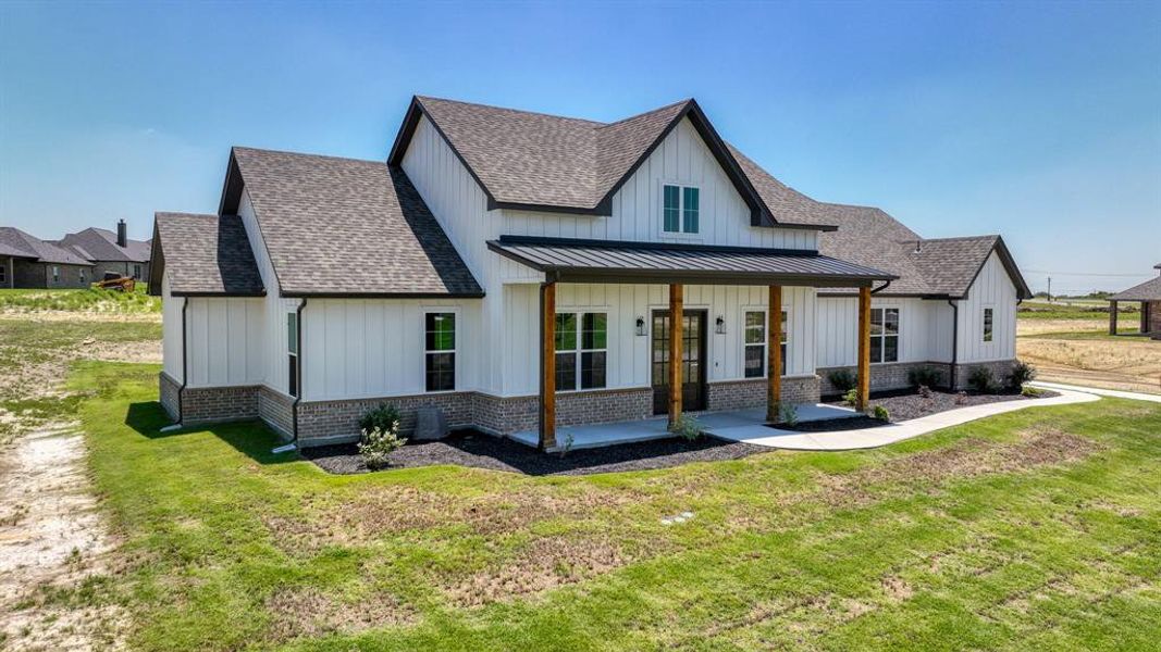 Modern inspired farmhouse with usable beautiful front lawn