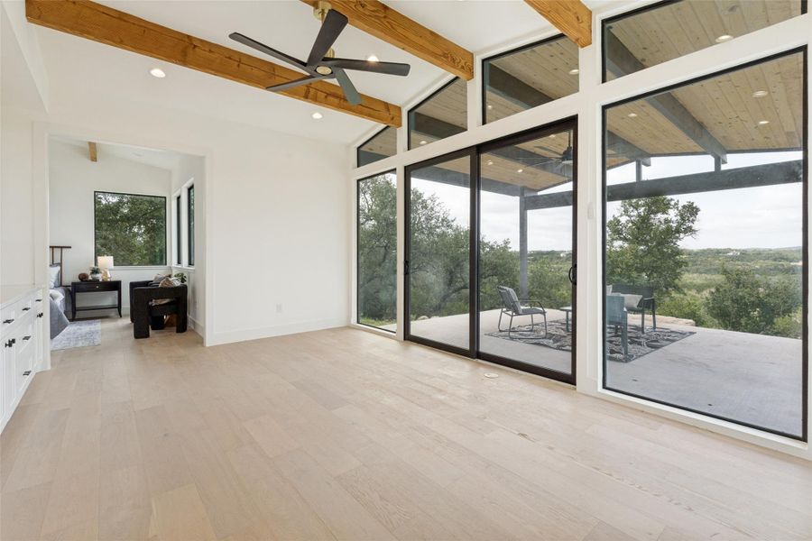 A wet bar and open living space offer modern comfort with a view.