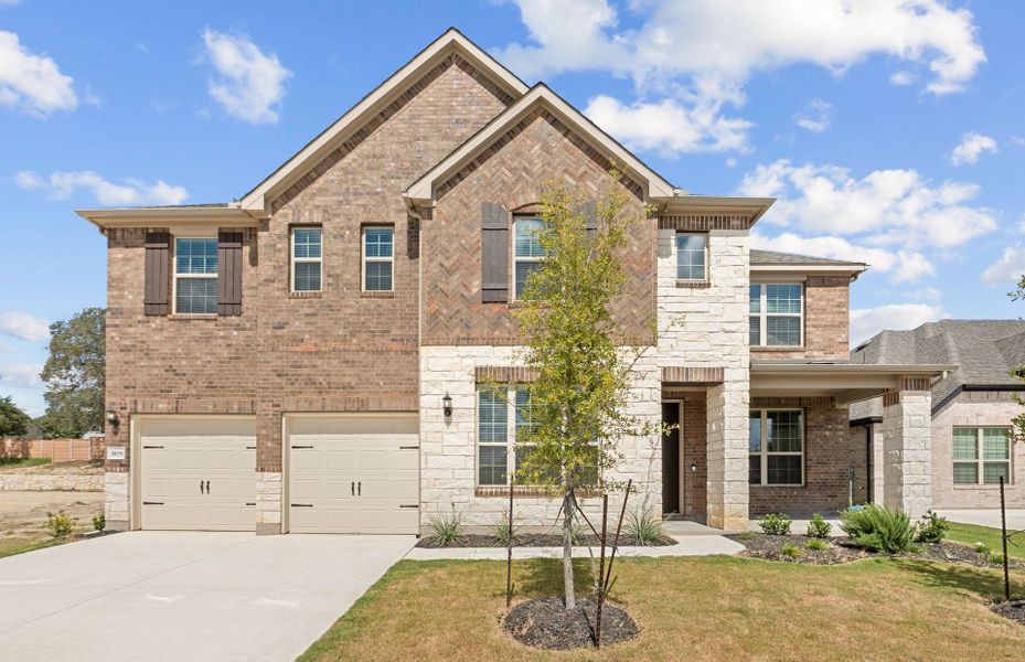 Front exterior of a new home in Bluffview Reserve, Leander, TX, highlighting curb appeal (Image 22).