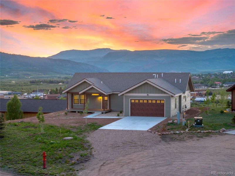 Front exterior of a new home in , Granby, CO, highlighting curb appeal (Image 17).