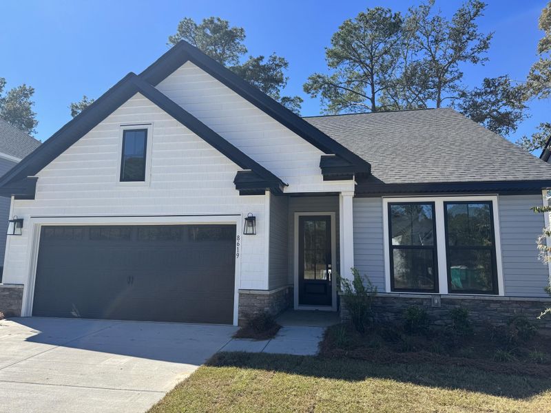 Front exterior of a new home in Indigo Place, North Charleston, SC, highlighting curb appeal (Image 2). Front exterior of a new home in Indigo Place, North Charleston, SC, highlighting curb appeal (Image 2).