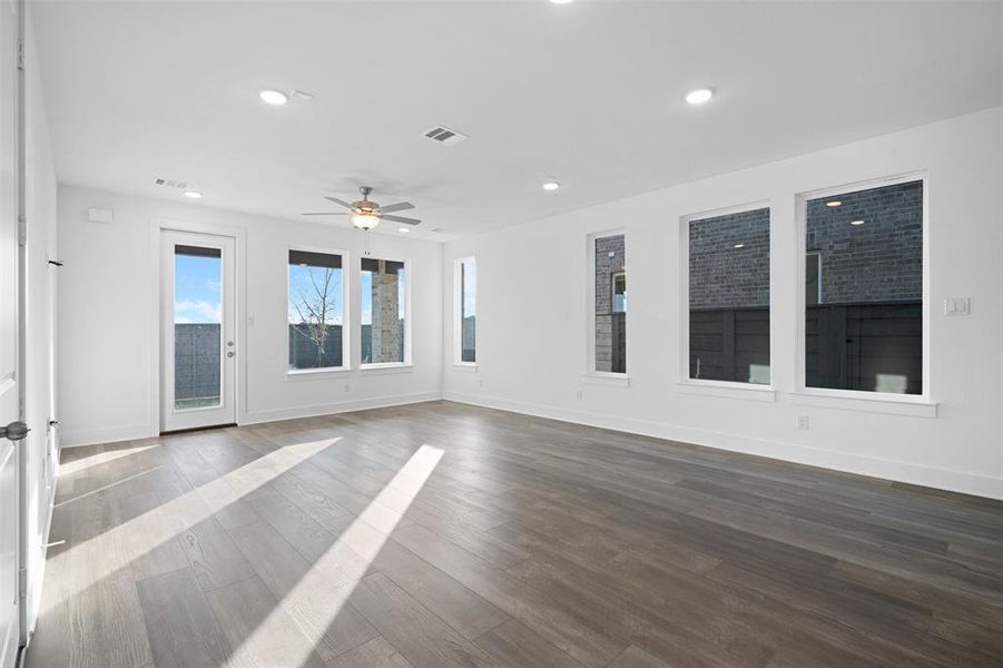 Spare room with ceiling fan and hardwood / wood-style floors