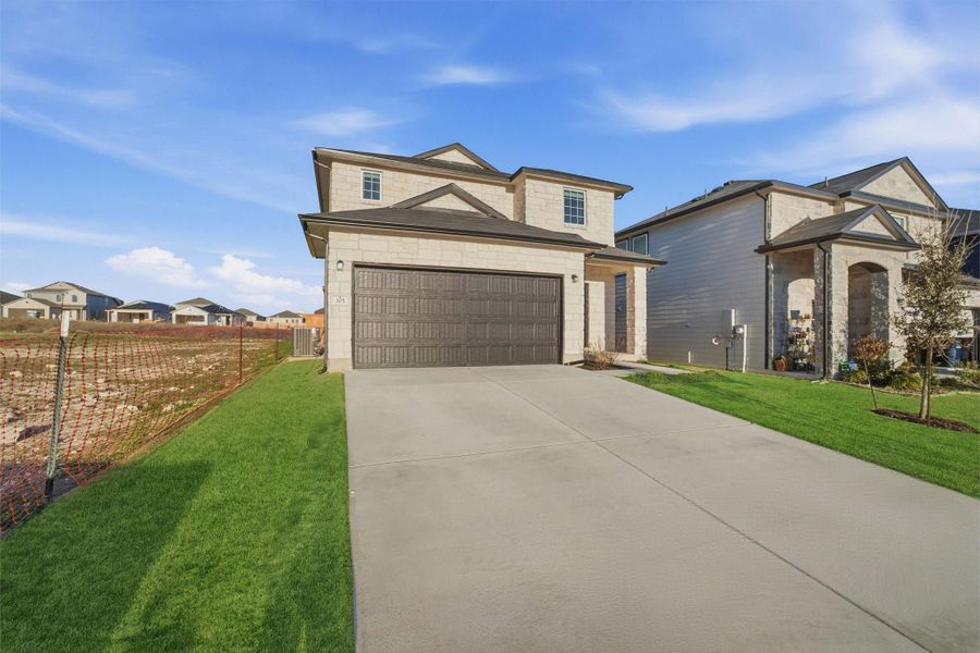 Front exterior of a new home in Cool Water, Jarrell, TX, highlighting curb appeal (Image 27).
