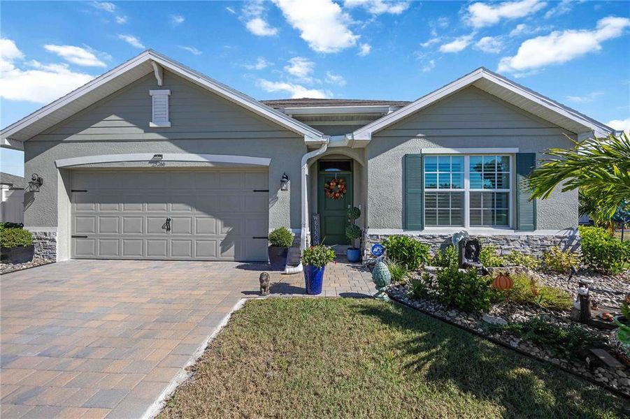 Front exterior of a new home in Burnt Store Village, Punta Gorda, FL, highlighting curb appeal (Image 2).