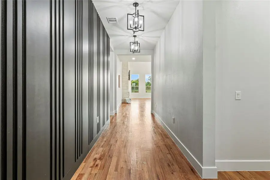 Hallway featuring light wood-type flooring Hallway featuring light wood-type flooring