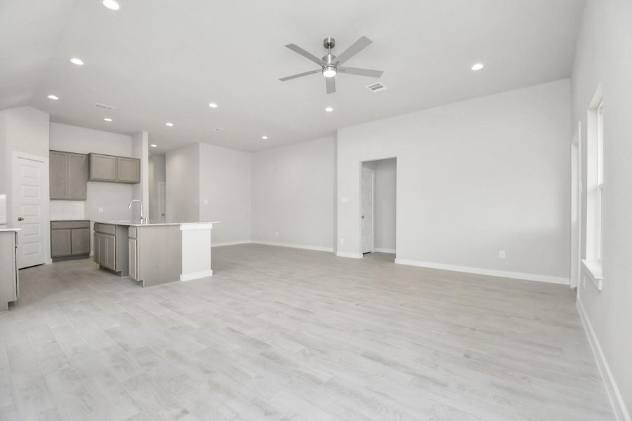 Discover another perspective of the expansive family room! Sample photo of completed home with similar floor plan. Actual colors and selections may vary. Discover another perspective of the expansive family room! Sample photo of completed home with similar floor plan. Actual colors and selections may vary.