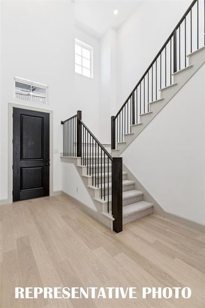 With a stunning open railing stair case, this gorgeous entry area is the perfect place to welcome family and friends! REPRESENTATIVE PHOTO With a stunning open railing stair case, this gorgeous entry area is the perfect place to welcome family and friends! REPRESENTATIVE PHOTO