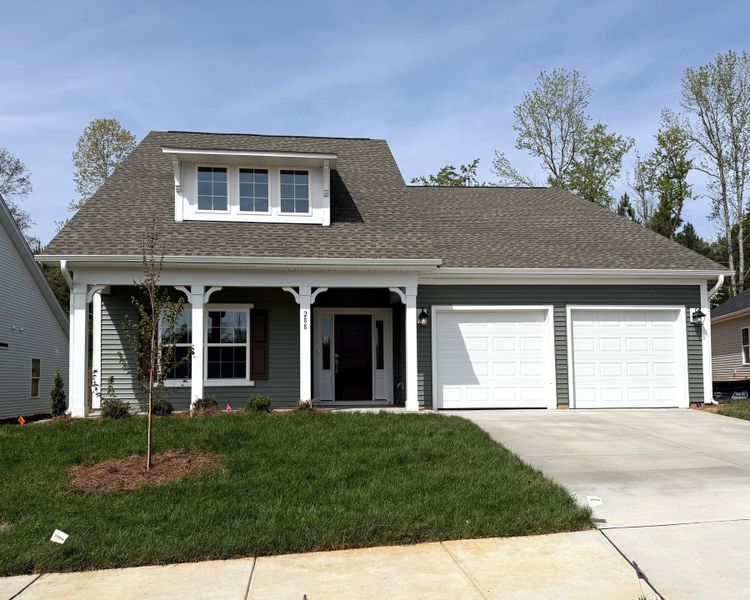 Front exterior of a new home in Brayden, Advance, NC, highlighting curb appeal (Image 1). Front exterior of a new home in Brayden, Advance, NC, highlighting curb appeal (Image 1).
