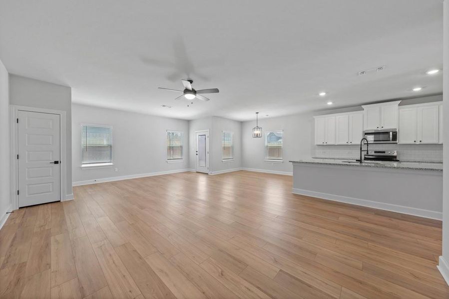 The heart of this remarkable home is the main living area, where the family room, dining room and the incredible kitchen come together to create a space that's truly the heart and soul of this property.